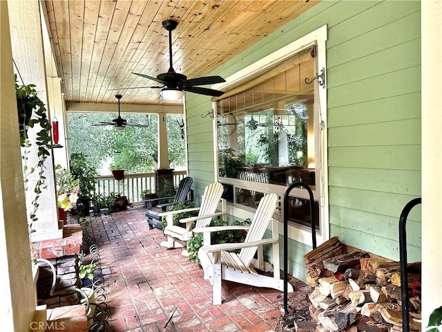 view of patio with ceiling fan and a porch