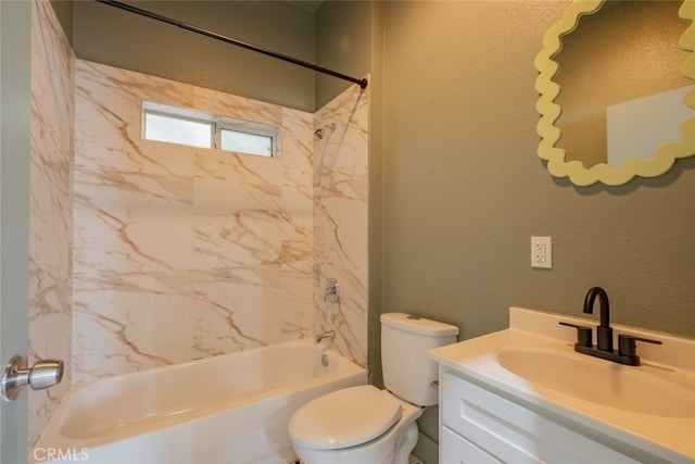 full bathroom featuring vanity, toilet, and tiled shower / bath combo