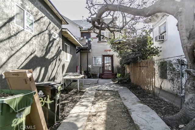 view of property exterior featuring a patio and cooling unit