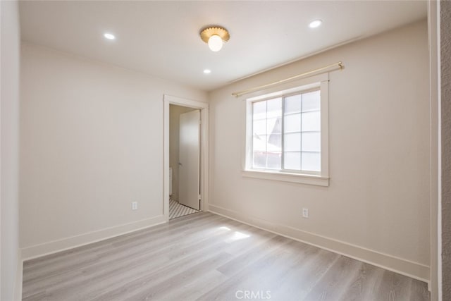 spare room featuring light hardwood / wood-style flooring