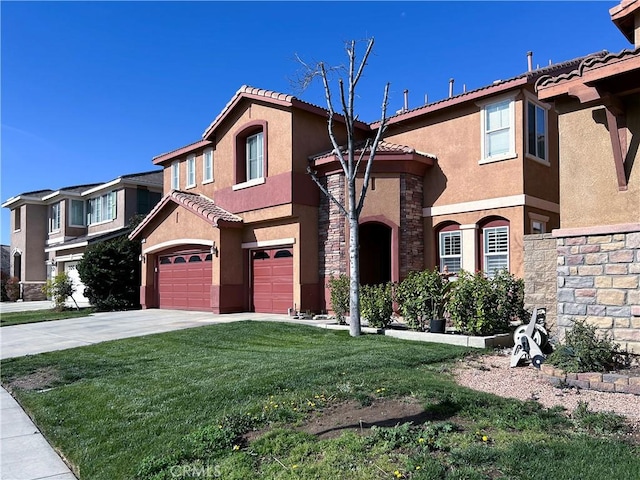 mediterranean / spanish-style home featuring an attached garage, stone siding, a front yard, and stucco siding