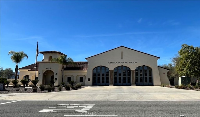 view of property with curved driveway