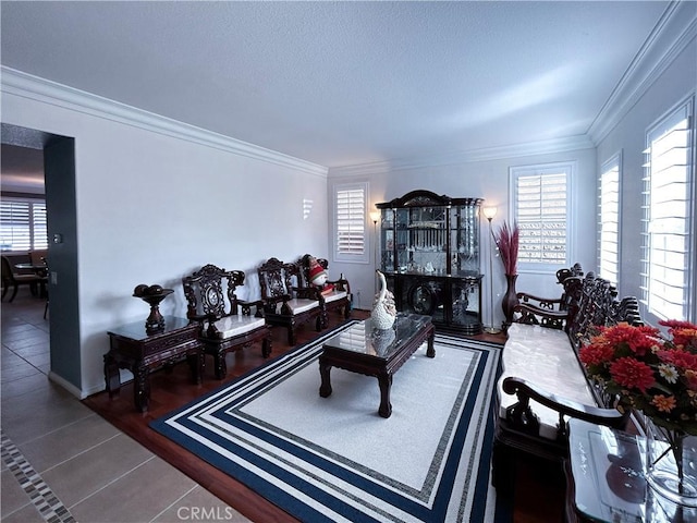 living area featuring ornamental molding and tile patterned flooring
