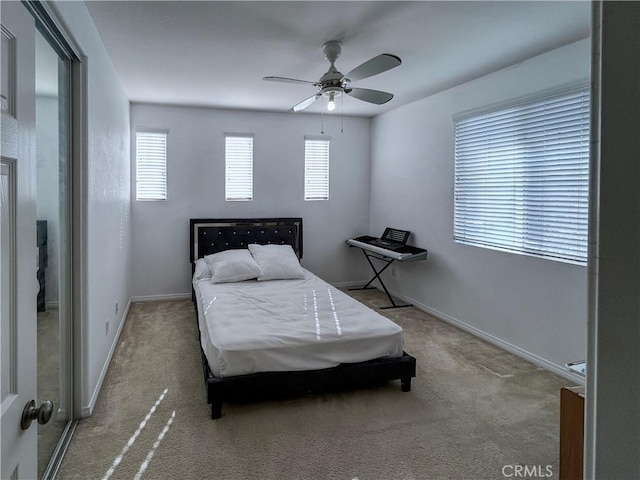 bedroom featuring ceiling fan, baseboards, and carpet floors