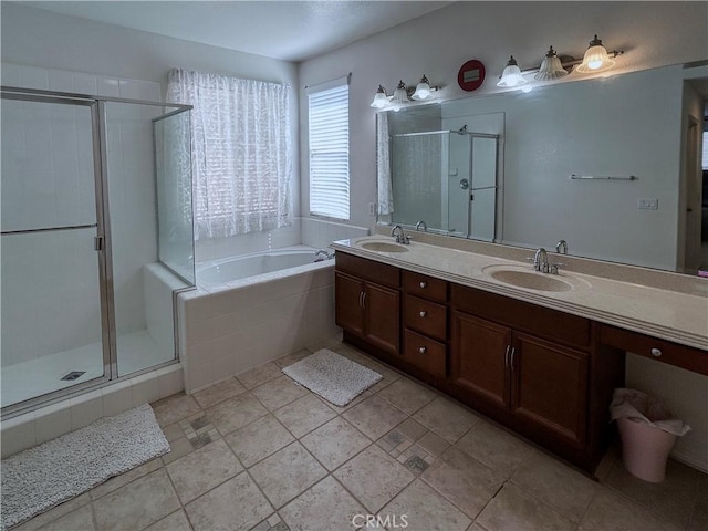 full bath featuring a shower stall, a garden tub, double vanity, and a sink