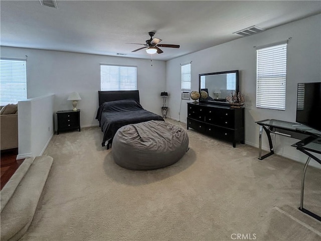 bedroom featuring carpet, visible vents, baseboards, and a ceiling fan