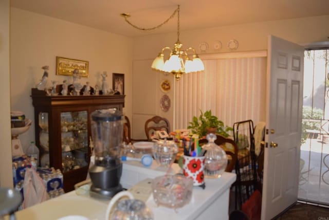 dining space featuring a notable chandelier