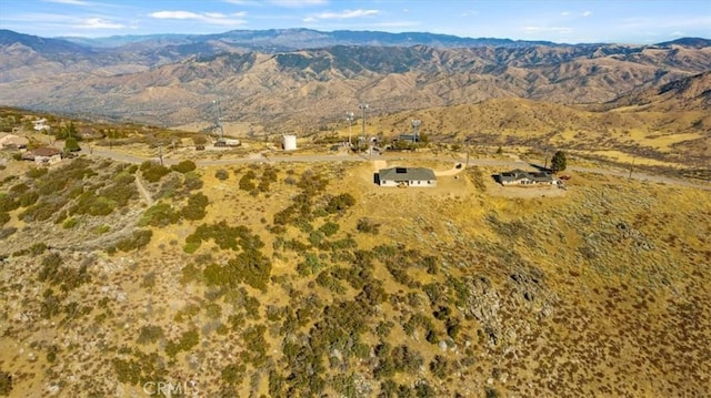 birds eye view of property featuring a mountain view