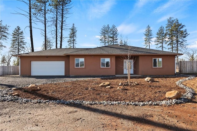 single story home with a garage