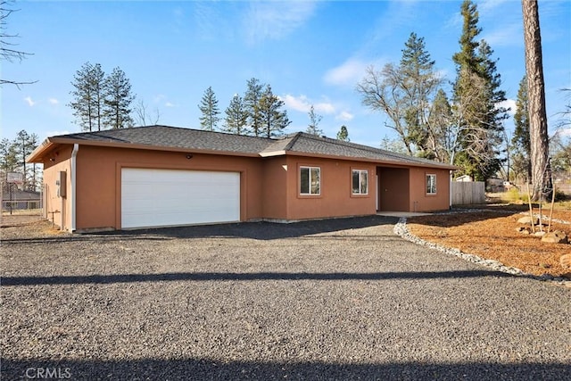 ranch-style home featuring a garage