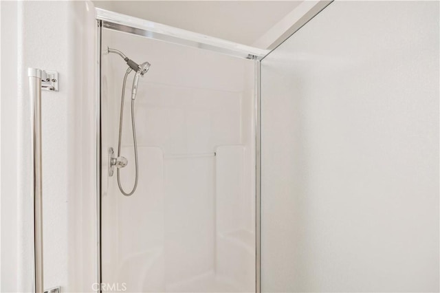 full bath featuring a stall shower