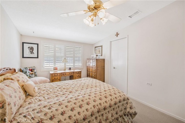 bedroom with baseboards, visible vents, ceiling fan, vaulted ceiling, and carpet floors