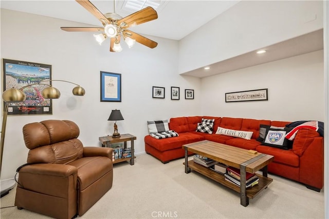 carpeted living room featuring a ceiling fan and recessed lighting