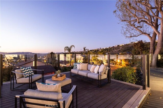 wooden terrace featuring outdoor lounge area