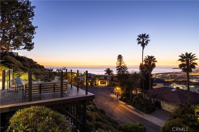 exterior space with an outdoor hangout area and a water view