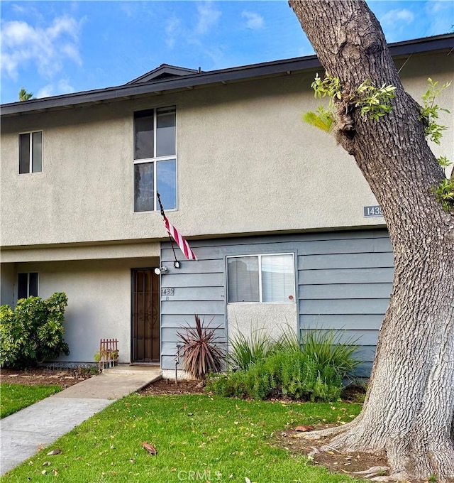 view of property featuring stucco siding