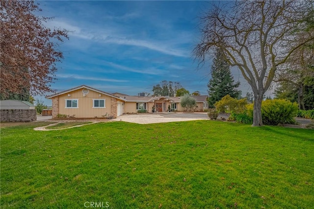 rear view of house featuring a yard