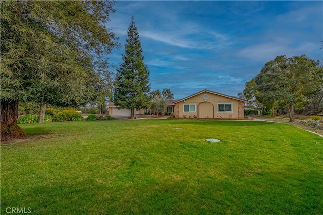 view of yard with a garage