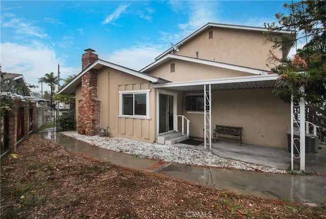 rear view of property with a patio