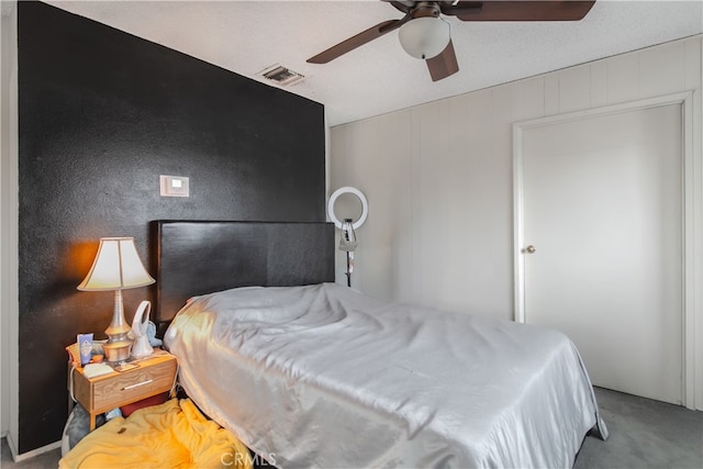 bedroom featuring light carpet and ceiling fan