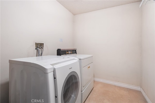 clothes washing area featuring independent washer and dryer