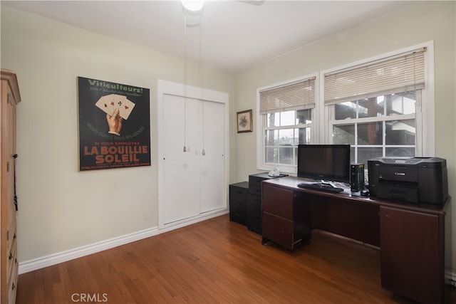 home office with hardwood / wood-style floors and ceiling fan