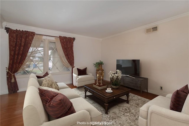 living room with crown molding and wood-type flooring