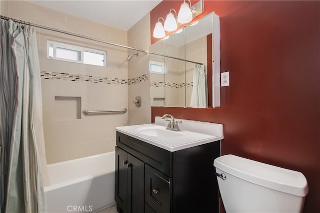 full bathroom featuring vanity, shower / tub combo, and toilet