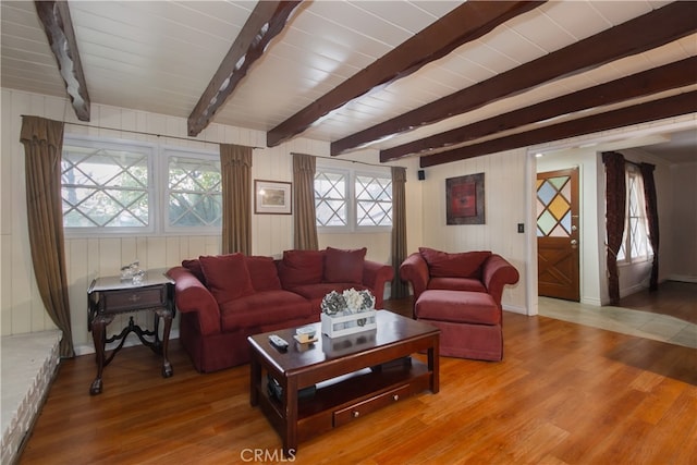 living room with hardwood / wood-style floors, beamed ceiling, and wood ceiling