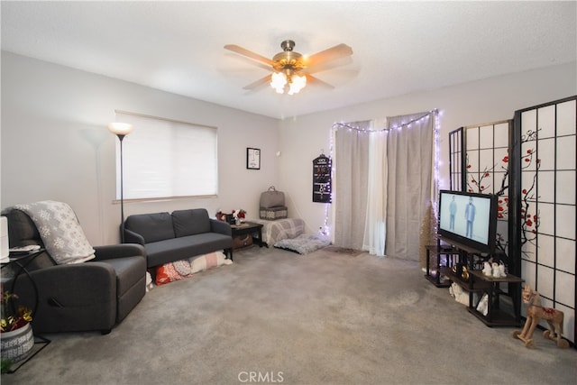 carpeted living room featuring ceiling fan