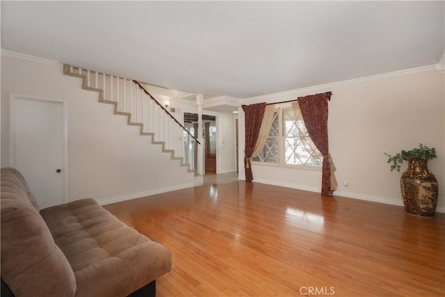 living room featuring ornamental molding and hardwood / wood-style flooring