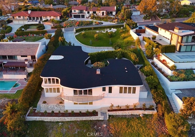 birds eye view of property with a residential view