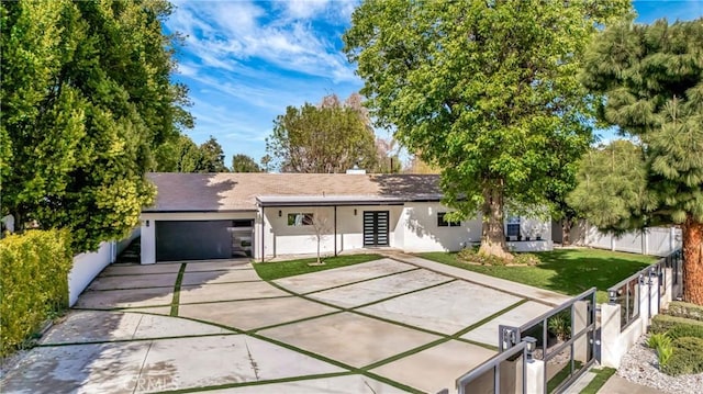 single story home with a garage