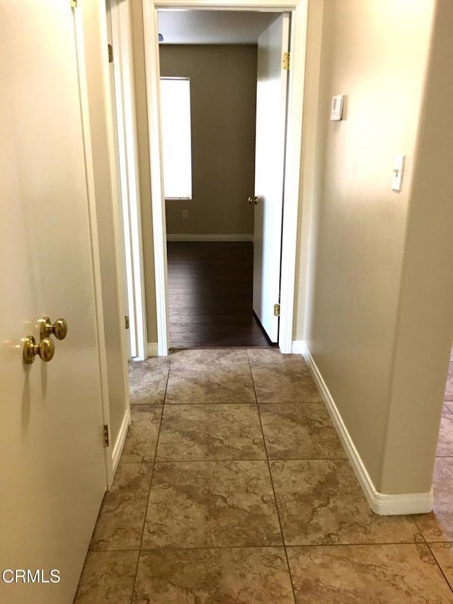 corridor with tile patterned floors