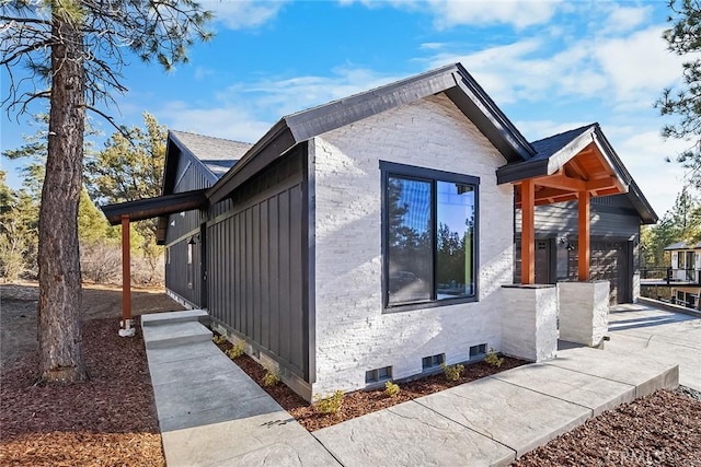 view of side of property with a garage