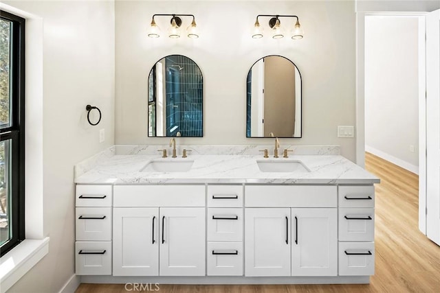 bathroom featuring vanity and wood-type flooring