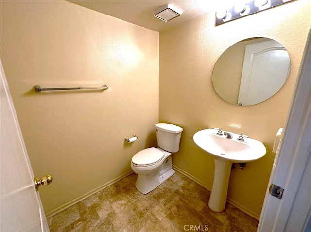 bathroom featuring toilet