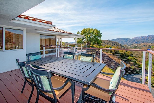 wooden deck with a mountain view