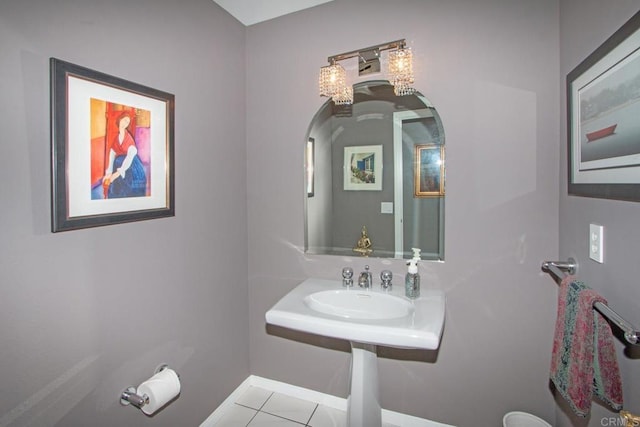 bathroom with tile patterned flooring and sink