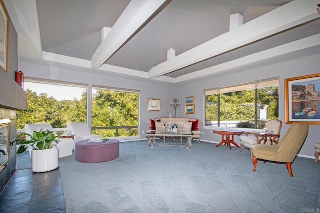 sunroom featuring beam ceiling