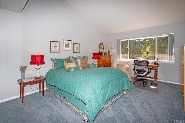 bedroom with lofted ceiling and carpet