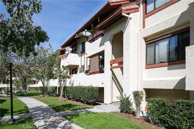 view of property's community with a lawn