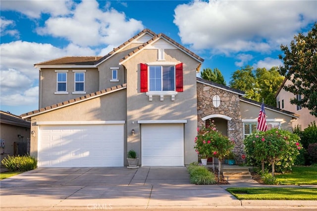 view of front facade featuring a garage, stone siding, driveway, and stucco siding