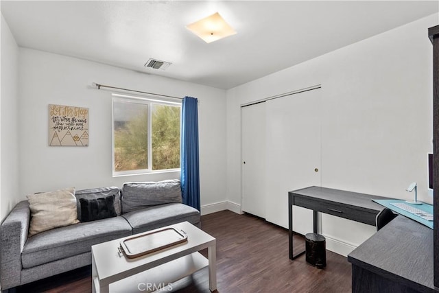 living room with dark hardwood / wood-style floors