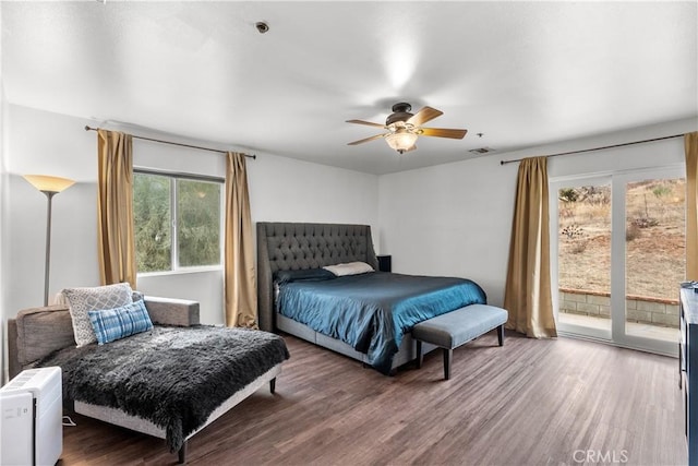 bedroom with ceiling fan, wood-type flooring, and access to exterior