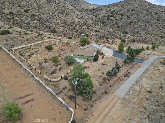 birds eye view of property with a mountain view