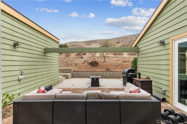 view of patio / terrace featuring outdoor lounge area and a grill