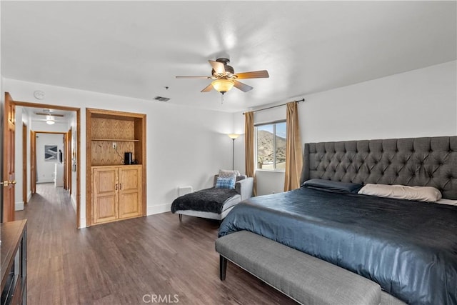 bedroom with hardwood / wood-style floors and ceiling fan