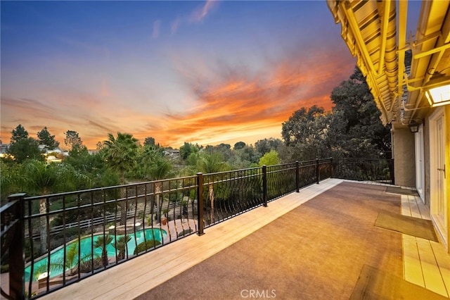 view of balcony at dusk