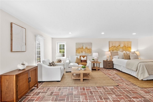 bedroom with brick floor and recessed lighting